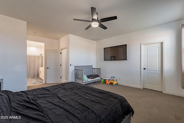 bedroom featuring carpet flooring, ceiling fan, ensuite bath, and baseboards