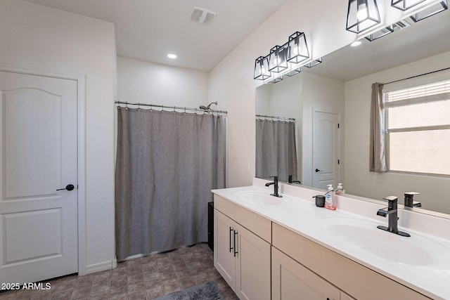 full bath with recessed lighting, visible vents, a sink, and double vanity