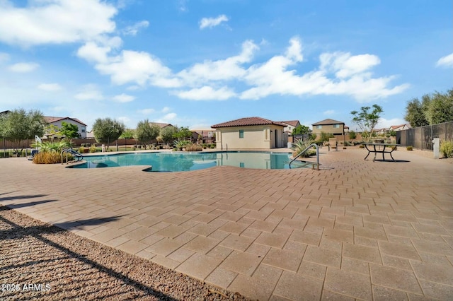 view of swimming pool with a patio