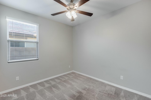 carpeted empty room with ceiling fan