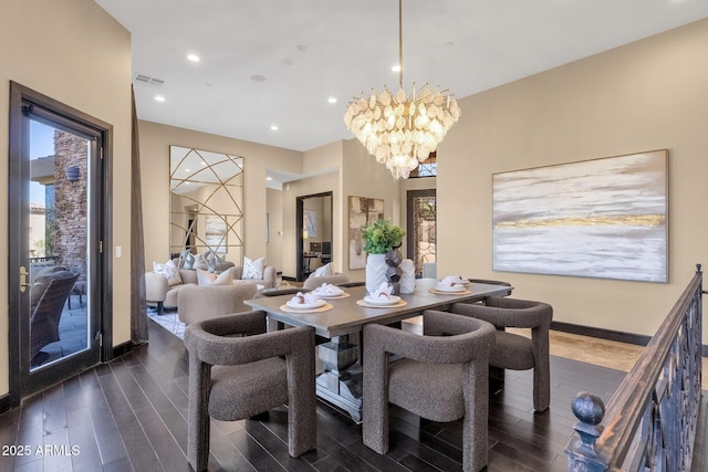 dining area with a chandelier, dark wood-type flooring, and a wealth of natural light