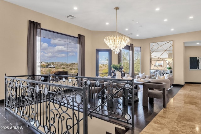 dining area featuring recessed lighting, visible vents, baseboards, and a notable chandelier