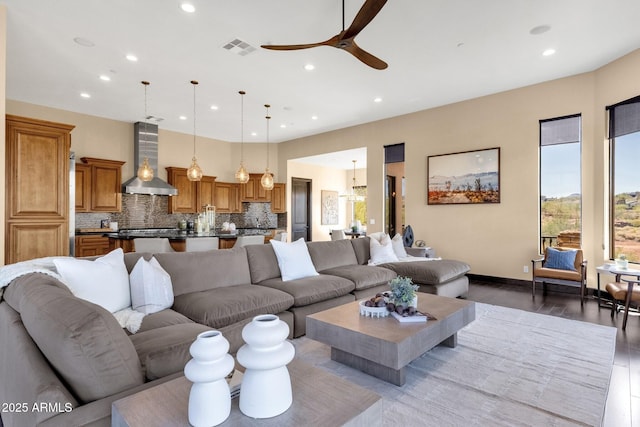 living room with visible vents, recessed lighting, and light wood-type flooring