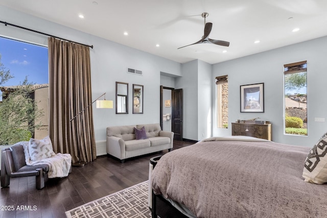 bedroom featuring a ceiling fan, visible vents, baseboards, recessed lighting, and dark wood-type flooring