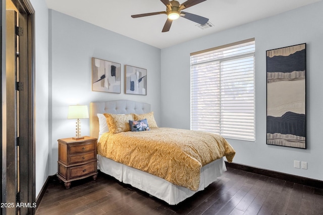 bedroom featuring dark wood-style floors, visible vents, and baseboards