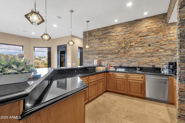 kitchen featuring a sink, brown cabinets, stainless steel dishwasher, and pendant lighting