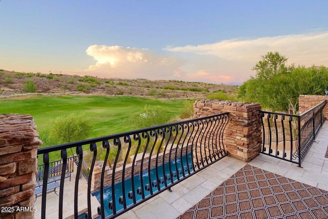 view of balcony at dusk