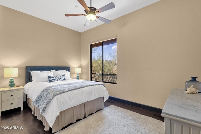 bedroom with a ceiling fan, baseboards, and wood finished floors