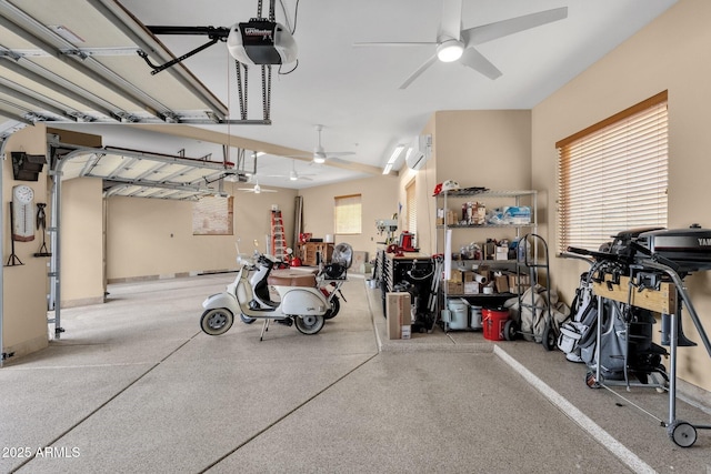 garage featuring ceiling fan, a garage door opener, and a wall unit AC