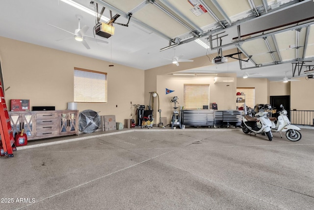 garage featuring ceiling fan and a garage door opener