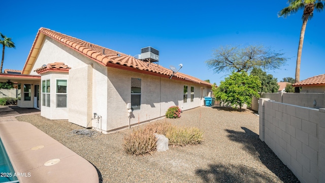 14248 N 56th Pl, Scottsdale, AZ 85254 - view of side of home featuring stucco siding and a tile roof