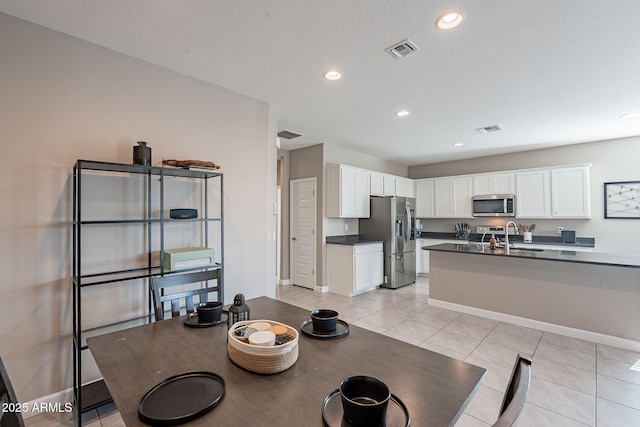 tiled dining area with sink