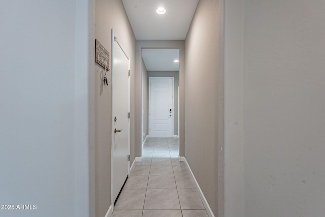 corridor with light tile patterned floors