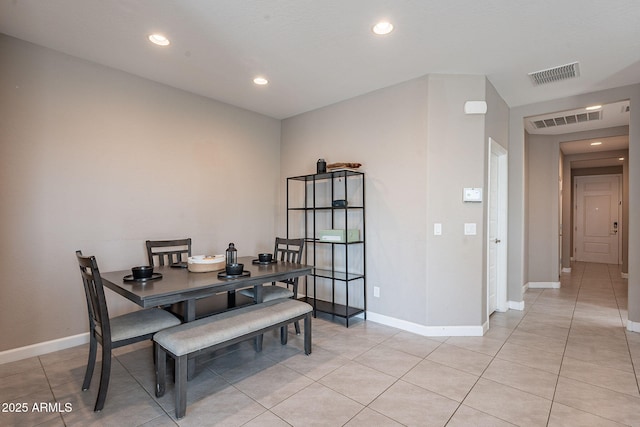 dining area featuring light tile patterned floors