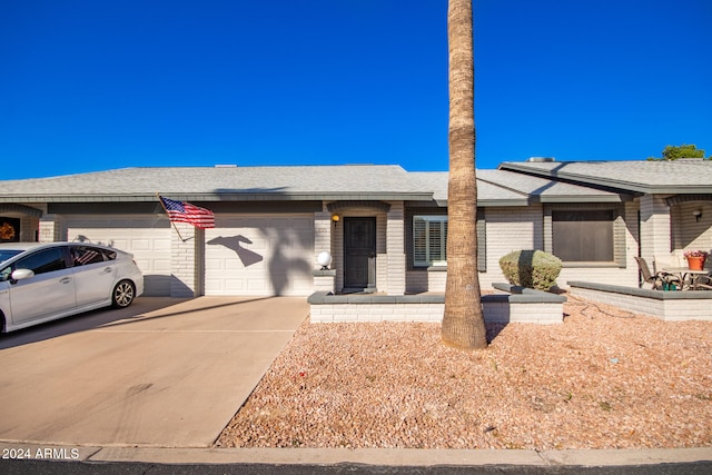 ranch-style house featuring a garage