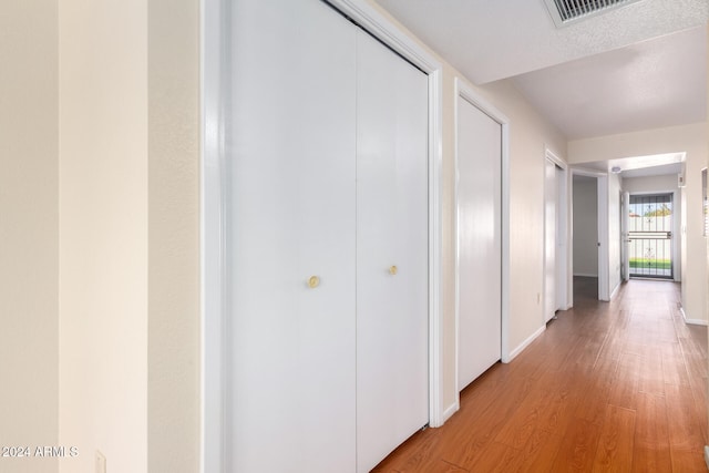 corridor featuring light wood-type flooring