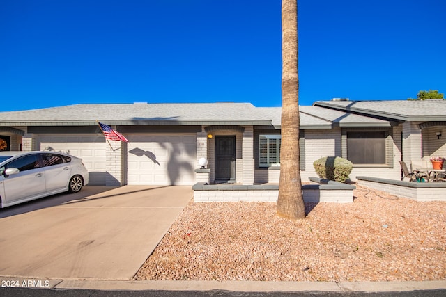 ranch-style home featuring a garage