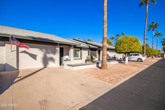 single story home with a garage