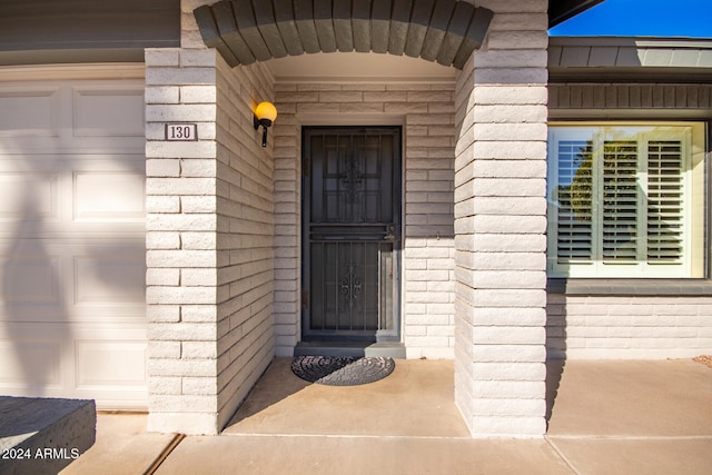 property entrance featuring a garage