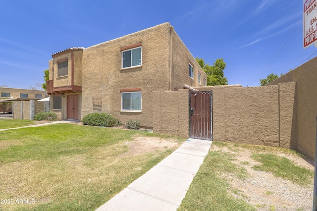 948 S Alma School Rd Unit 1, Mesa, AZ 85210 - view of front of house featuring a gate and stucco siding