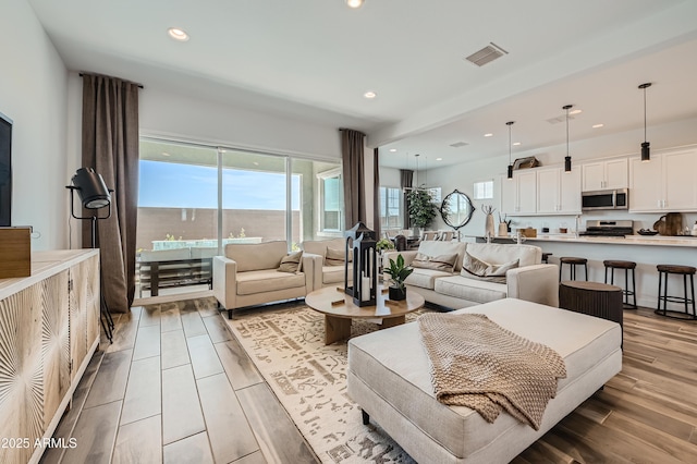 23032 E Roundup Way, Queen Creek, AZ 85142 - living room with plenty of natural light and recessed lighting