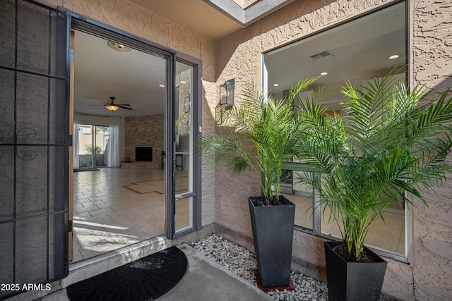 doorway to property with stucco siding