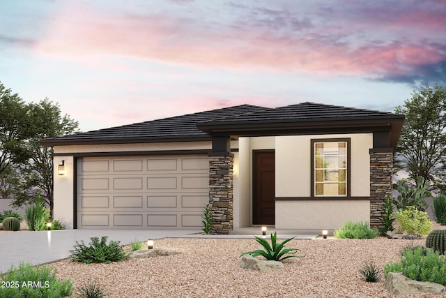 prairie-style home with concrete driveway, a garage, stone siding, and stucco siding