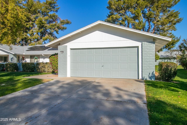 garage featuring a lawn