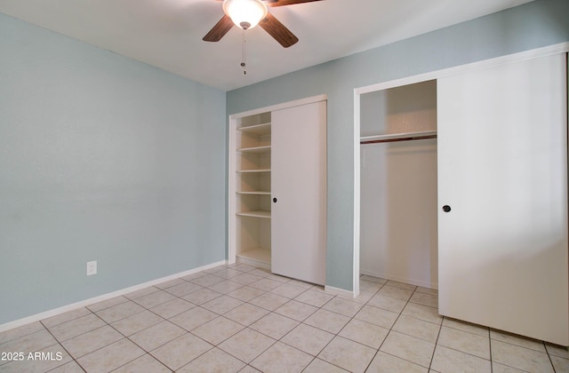 unfurnished bedroom featuring ceiling fan and light tile patterned flooring