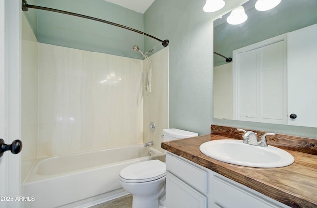 full bathroom featuring shower / tub combination, vanity, and toilet