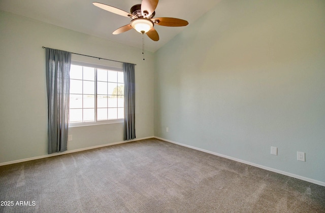 carpeted empty room featuring ceiling fan and vaulted ceiling