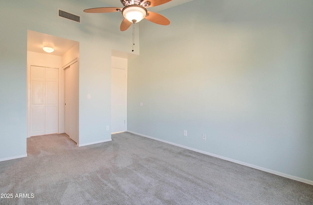 carpeted empty room featuring ceiling fan