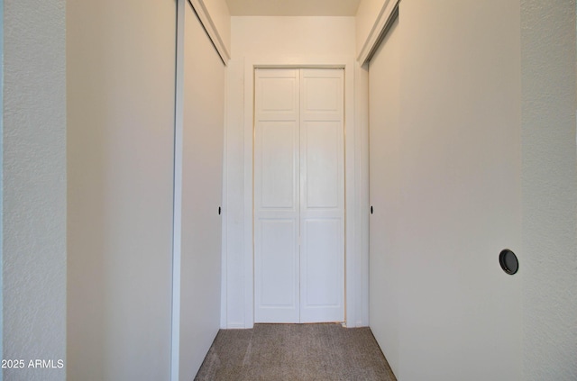 corridor with carpet floors