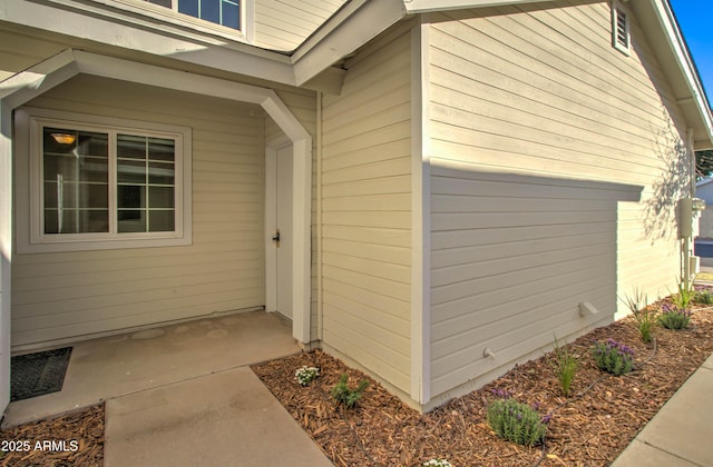 property entrance featuring a patio area