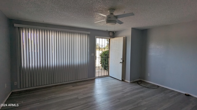 spare room with wood-type flooring, ceiling fan, and a textured ceiling