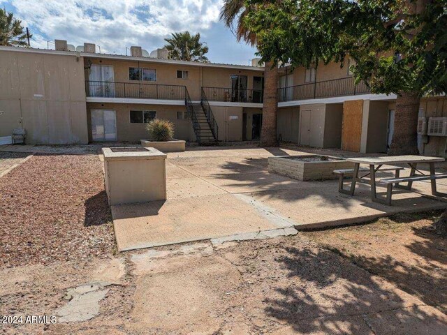 view of home's community featuring a patio