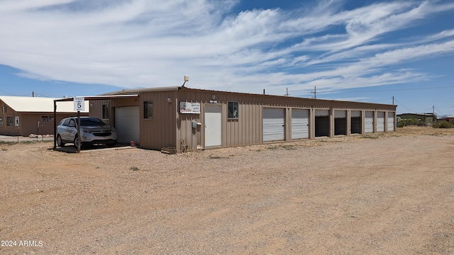 exterior space with an outbuilding and a garage