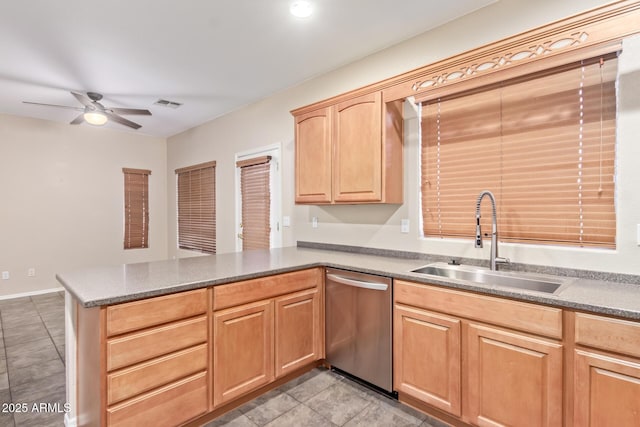 kitchen featuring light brown cabinetry, stainless steel dishwasher, sink, kitchen peninsula, and ceiling fan