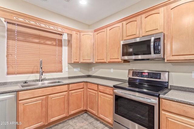 kitchen with sink, light brown cabinetry, and appliances with stainless steel finishes