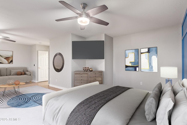 bedroom featuring ceiling fan and light hardwood / wood-style floors