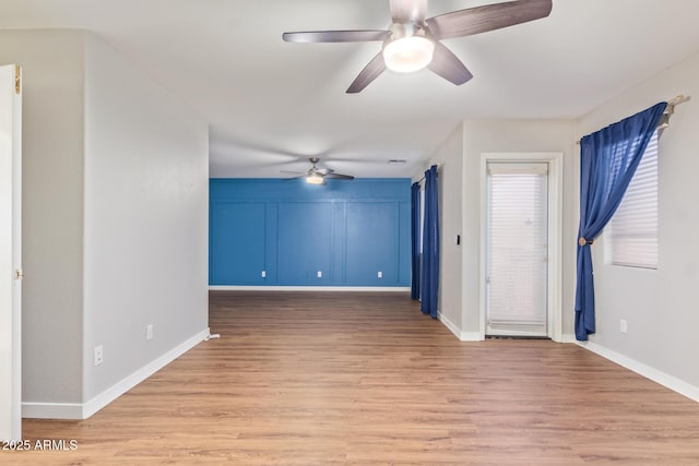 unfurnished room with light hardwood / wood-style floors and ceiling fan