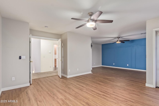 unfurnished living room featuring light hardwood / wood-style floors and ceiling fan