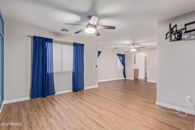 unfurnished room with ceiling fan and hardwood / wood-style floors