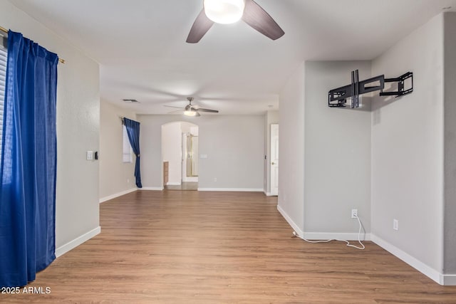 spare room featuring ceiling fan and light hardwood / wood-style floors