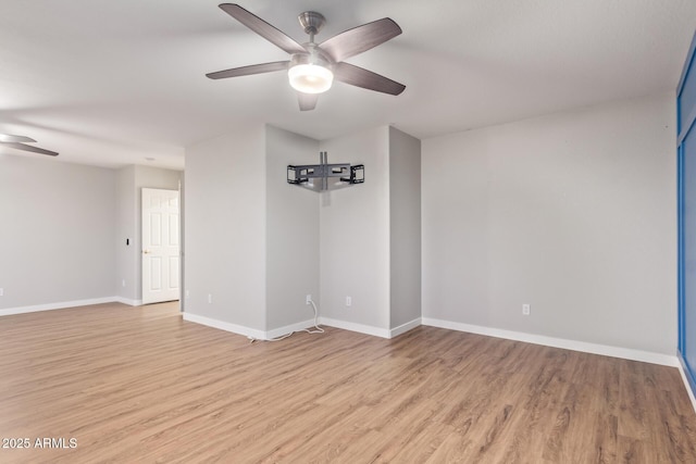 unfurnished room featuring light wood-type flooring and ceiling fan