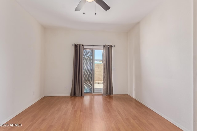 spare room featuring light wood-type flooring and ceiling fan