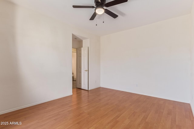 unfurnished room with light wood-type flooring and ceiling fan