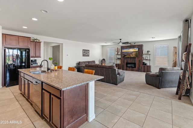 26032 W Quail Ave, Buckeye, AZ 85396 - kitchen featuring black fridge with ice dispenser, dishwasher, light tile patterned floors, ceiling fan, and a sink