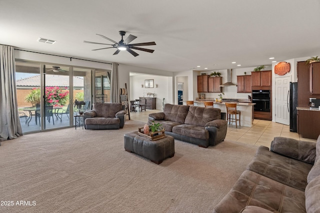 26032 W Quail Ave, Buckeye, AZ 85396 - living area featuring a ceiling fan, light carpet, recessed lighting, and light tile patterned floors