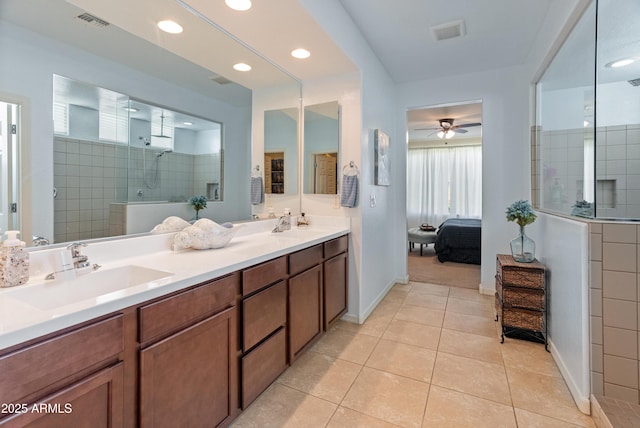 26032 W Quail Ave, Buckeye, AZ 85396 - ensuite bathroom with walk in shower, double vanity, tile patterned flooring, baseboards, and recessed lighting